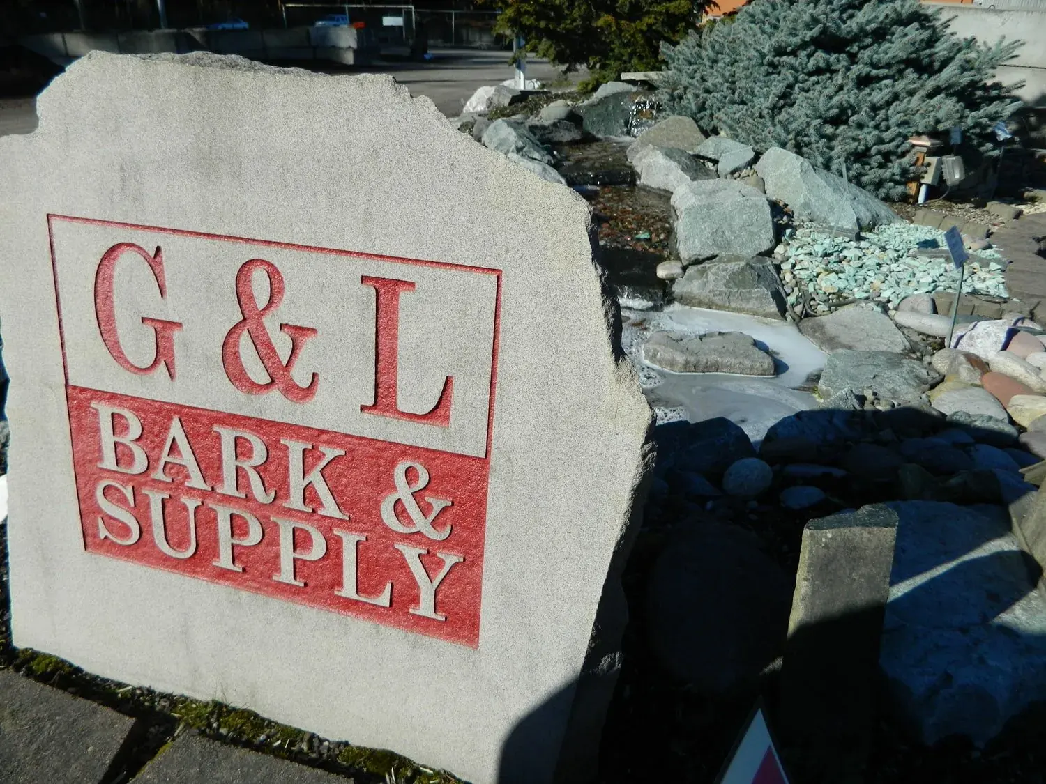 G&L Bark & Supply yard display showcasing rock and landscape materials